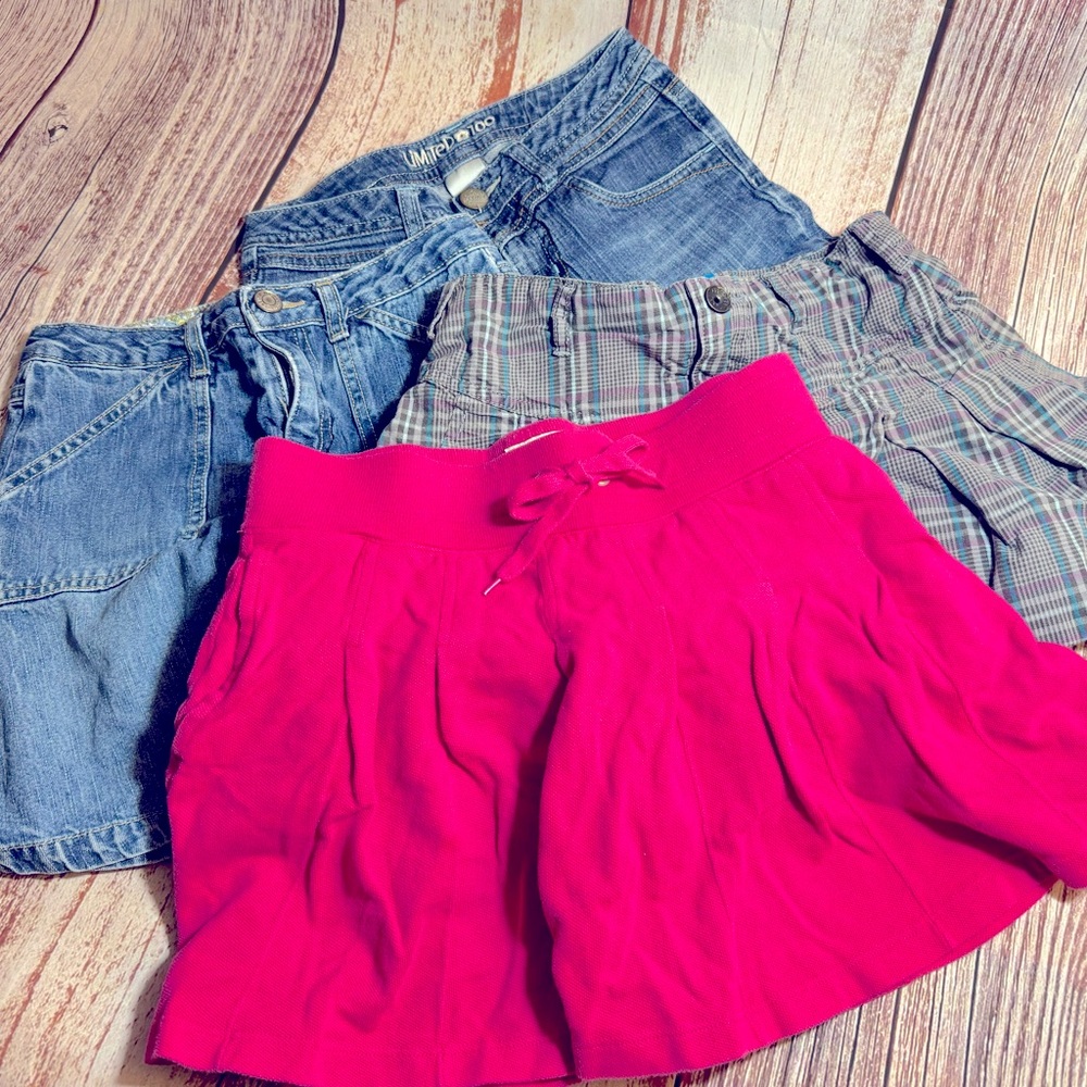 3 skirts w/attached shorts and 1 pairs jeans shorts. Size 10. Assorted brands